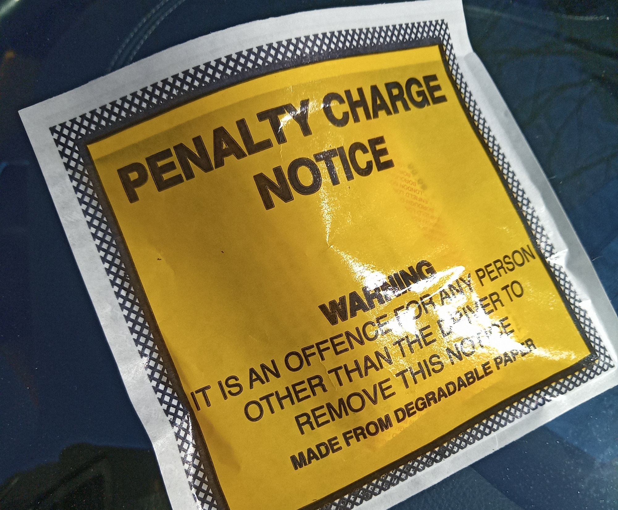 Penalty charge notice stuck to a car windscreen